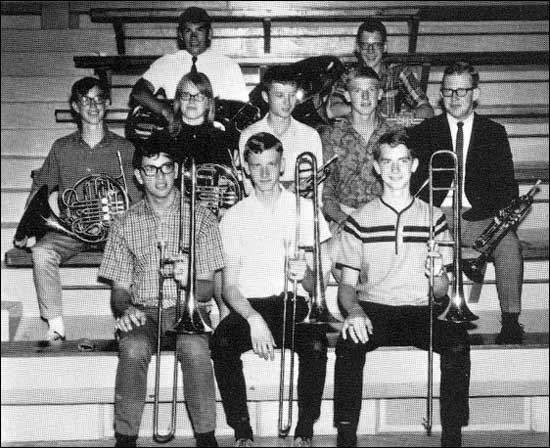 This photo is from the 1967 Brave yearbook and is of the PRHS brass ensemble,
which received a I (one) rating at the state music festival in spring 1967. 
Pictured are (top row) Glenn Mull and Larry Smith; (middle row) Marty Loving, Edna Kasselman, Tom Morris, Terry Schneider, and Alan Dunavan; (front row) Roger Unruh, Howard Deckert, and Verlin White.  Barb Schmidt scanned this image and sent it to us. She added: This group had a  great brass sound and was lots of fun to hear and watch.  Tom Morris finished up at Larned High School and then played trumpet in the Navy Band, followed by a long and successful career as a professional musician, though somewhere along the way he changed Tom to Thom. I don't know but have wondered whether any of the others in this photo continued to play brass instruments after high school.