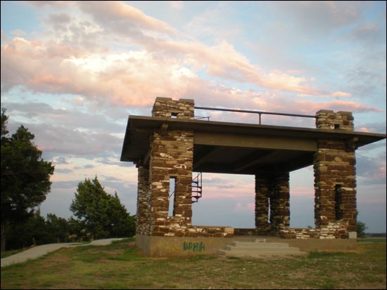 The setting sun brightens the pavilion atop Pawnee Rock State Park. Photo copyright 2014 by Leon Unruh.