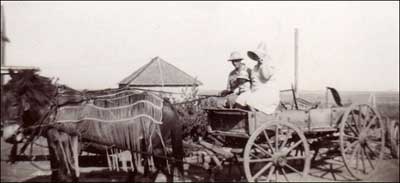 Paul and Bernice Schmidt, with young Larry, on their farm in the early 1940s. They lived a half-mile west of where the salt plant once was. Barb Schmidt, their daughter, sent the photo.