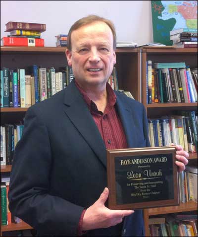 Leon Unruh at UAF with the Faye Anderson Award plaque honoring him for his work preserving and interpreting the Santa Fe Trail. Photo by University of Alaska history professor Diana DiStefano. Copyright 2013 by Leon Unruh.