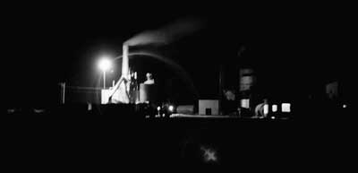 Larned alfalfa dehydration plant at night, 1970s. Photo copyright 2009 by Leon Unruh.