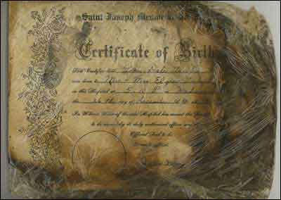 Birth certificate (burned).