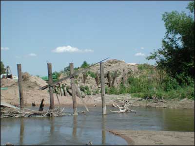 Bridge pilings remaining from the old wooden bridge, 2000. Photo copyright 2009 by Leon Unruh.