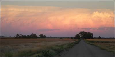 Sunset lights up a thunderhead east of Pawnee Rock. Photo copyright 2010 by Leon Unruh.