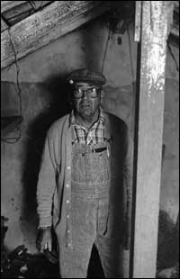 Elgie Unruh in the backyard cellar of the Otis and Lena Unruh farm. Photo copyright 2009 by Leon Unruh.