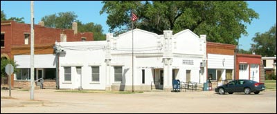 Pawnee Rock post office and the former drugstore on the west and north sides of the post office. Photo copyright 2009 by Leon Unruh.