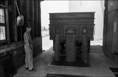 Man working in the Dundee elevator, 1976. Photo copyright 2009 by Leon Unruh.