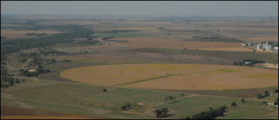 After takeoff: Dundee is on the right and the Arkansas River's path can be traced by following the string of trees on the left. Photo copyright 2010 by Jim Dye.