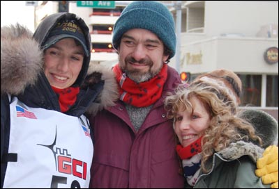 Eric Deeter, flanked by Jeff and Gretchen, at the start of the 2008 Iditarod Trail Sled Dog Race in Anchorage. Photo copyright 2008 by Leon Unruh.