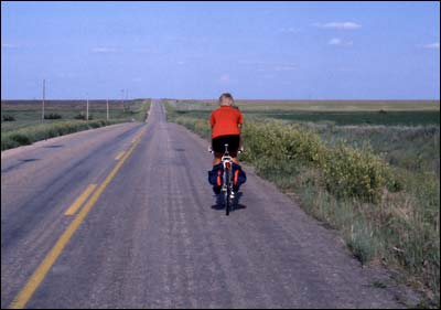 Leon Unruh riding north on the Mennonite Church Road near Pawnee Rock, 1981. Photo copyright 2009 by Leon Unruh.