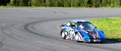 Nik motors around turn two at the North Pole Speedway. Photo copyright 2010 by Leon Unruh.