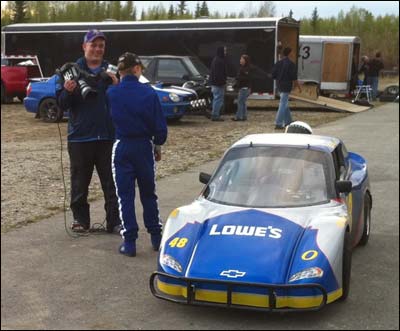 Jaime Schwarzwald interviews Nik Unruh after a race at the North Pole Speedway, 2011. Photo copyright 2011 by Leon Unruh.