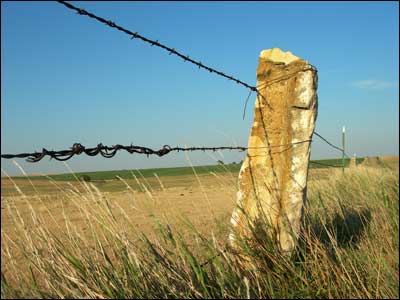 Post rock and barbed wire along pasture north of Pawnee Rock. Photo copyright 2009 by Leon Unruh.