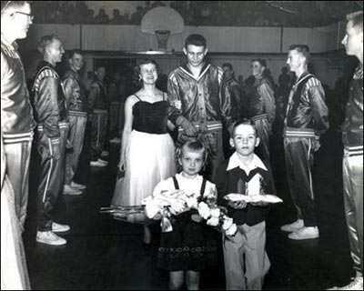 Pawnee Rock High School basketball homecoming, 1953: Queen Nita Geil, King Dean Blackwell, flower girl Deana Hixon, crown bearer Mike Durall. The other players are Roger Seibert, Don Schultz, Larry Kopke, JimBob Svatos, Darry Drake, Bill Wilson, Bennie Baldwin, and Ed Durall.