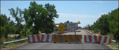 Signs and barriers at the Radium Bridge over the Arkansas River, August 2010. Photo copyright 2010 by Leon Unruh.