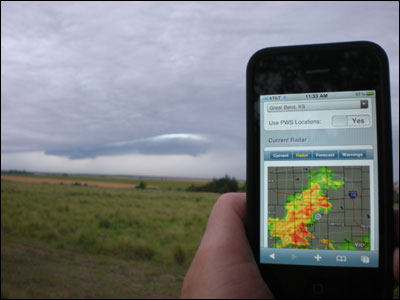 An approaching storm is visible on my iPhone. Photo copyright 2010 by Leon Unruh.