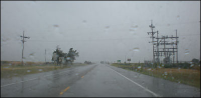 Driving southwest out of Pawnee Rock in the rain. Photo copyright 2010 by Leon Unruh.