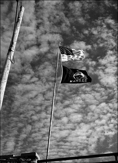 U.S. and Kansas flags atop Pawnee Rock State Park, 1974. Photo copyright 2010 by Leon Unruh.