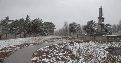 The curved sidewalk on the south lip of Pawnee Rock State Park. Photo copyright 2011 by Jim Dye.