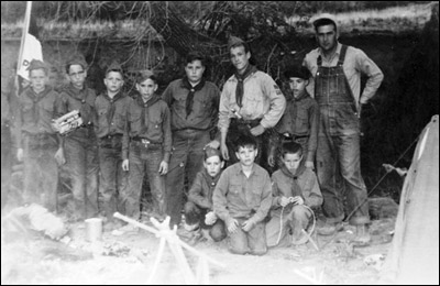 Pawnee Rock Scouts in uniform, in the 1950s: Left to right:  (standing) Andy Deckert, Bob Delaplane, Larry Schmidt, Larry Robinson, unidentified Scout, Dick Myers, Larry Holmes, Jim Wilhite; (seated) Gary McDowell, unidentified Scout, Delaine (Joe) Levingston.