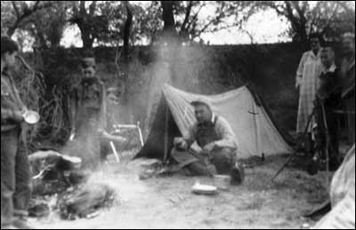 Scout leader Jim Wilhite and members of Troop 174 have vistors at their campsite: Phyllis Deckert, Bob Schmidt, and Bernice Schmidt. Photo sent by Barb Schmidt.