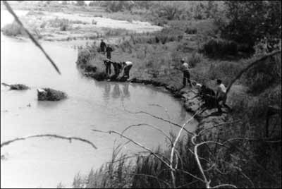 Members of Pawnee Rock's Boy Scout Troop 174 mess around on the bank of the Pawnee River at Camp Pawnee, 1951. Photo sent by Barb Schmidt.