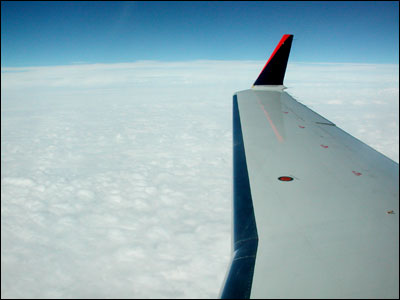 Photo of a United Airlines wing over central Kansas. Photo copyright 2008 by Leon Unruh.