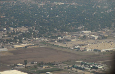 Great Bend's busiest store -- Walmart -- sprawls out on the right side of this photo, looking northward toward 10th Street. The Central Kansas Medical Center is the set of stacked disks in the middle left, and a newer medical facility is in the lower right. Photo copyright 2010 by Jim Dye.